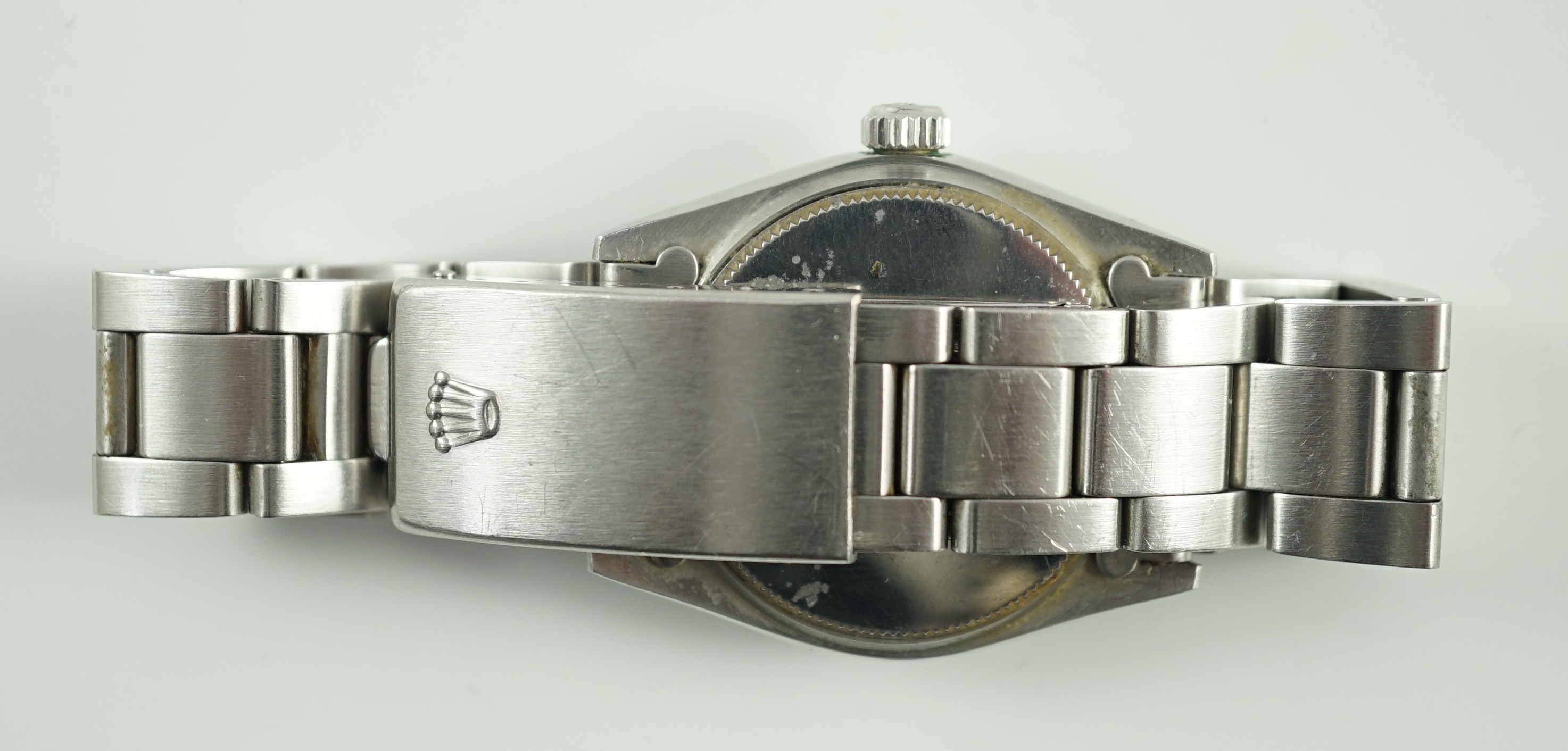 A 1980's mid-size stainless steel Rolex Oysterdate Precision manual wind wrist watch, on a stainless steel Rolex bracelet